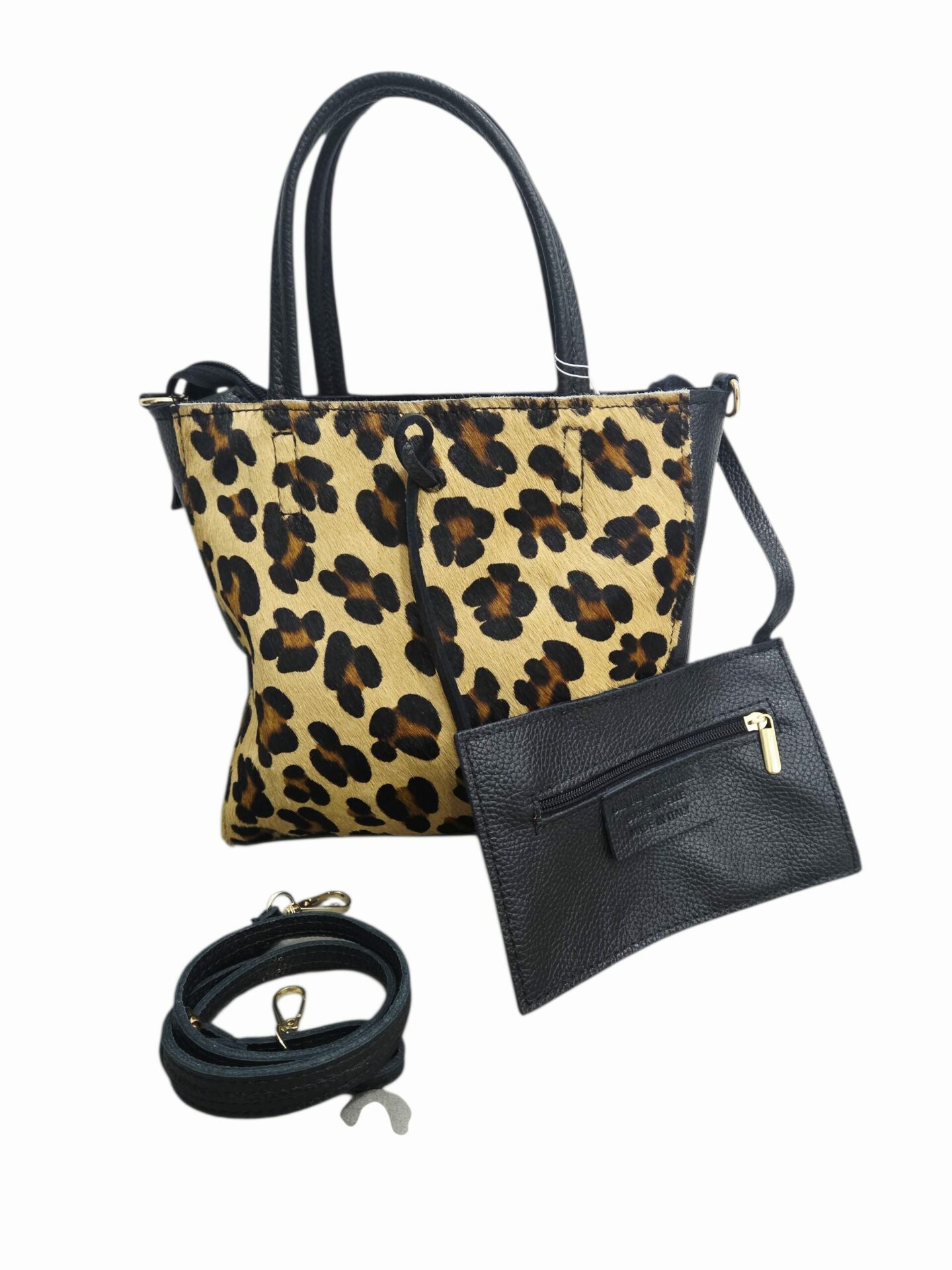 Bag made of genuine leather and spotted pony skin, made in Italy, zip closure, bare interior with removable purse and shoulder strap. Measurements H24 W7 L28 Free shipping Borsa realizzata in vera pelle e cavallino maculato ,made Italy, chiusura con zip,interno nudo con borsellino estraibile e tracolla.Misure H24 B7 L28 Spedizione Gratuita