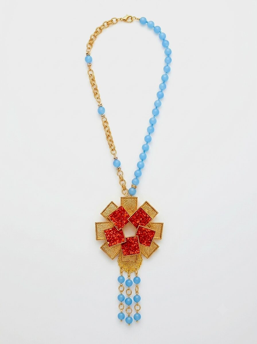Collana girocollo regolabile  realizzata con giada, pendente in ottone con corallo ed elementi dorati anallergici satinati.
lunghezza girocollo 46cm
lunghezza pendente 18cm Spedizione Gratuita